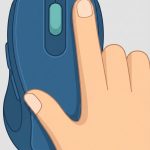 Close-up of a hand clicking a blue computer mouse.